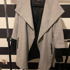 Peacoat with sweater sleeve accent.